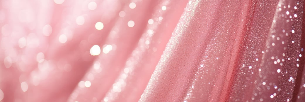 The shimmering pink fabric beautifully draped in an elegant manner is simply perfect for fashion and event designs photo