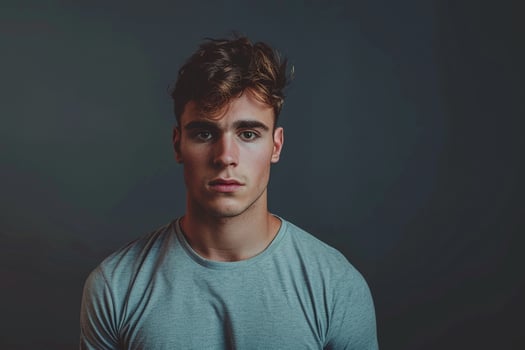 Fashion Model in Basic Tee Grey Background Relaxed portrait Stylish and Comfortable Males Casual Fashion photo