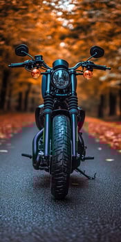 A stunning motorcycle parked on a rural road at sunset, highlighting its metallic parts against a dramatic sky, symbolizing freedom and adventure in a modern, artistic style. photo