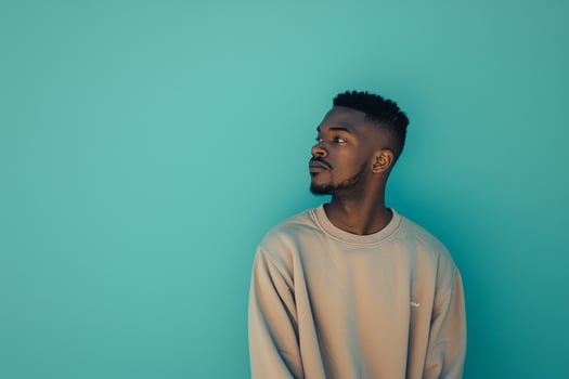 Handsome Fashion Model in sweatshirt male dress withteal Lifestyle Males portrait Fashion Male Backgroundlifestyle portrait photo