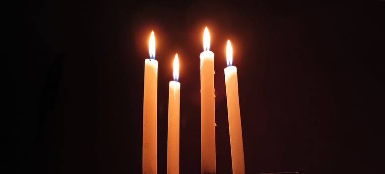 A beautiful scene where four candles are lit in a row. photo