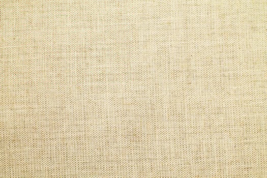 Natural linen material textile canvas Fabric texture background Close-up detail of fabric natural color Hemp material pattern design wallpaper. can be used as background or for graphic design photo