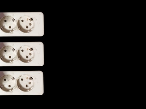 White electrical plug in wall socket. photo