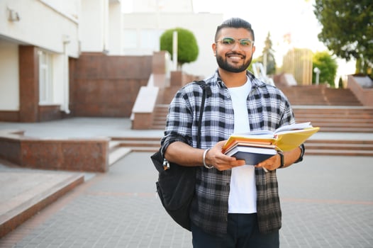 Happy indian male student at the university photo