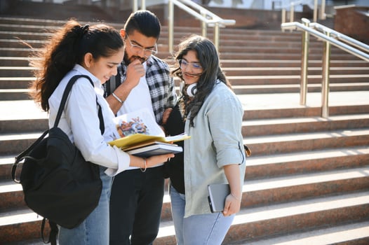 Cheerful Indian asian young group of college students or friends together photo