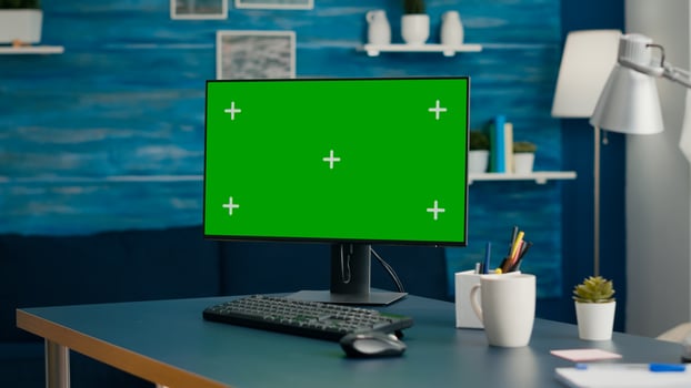 Modern computer with mock up green screen chroma key set up for personal business work. Professional pc with isolated display sitting on office desk in home office with nobody in it photo