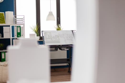Stand with drawing plans for real estate development in modern architect open space office. Architectural design board with blueprints for urban planning building complex . photo