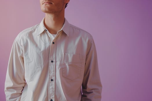 Stylish male in a simple shirt lavender background relaxed portrait clean fashion modern lifestyle photo