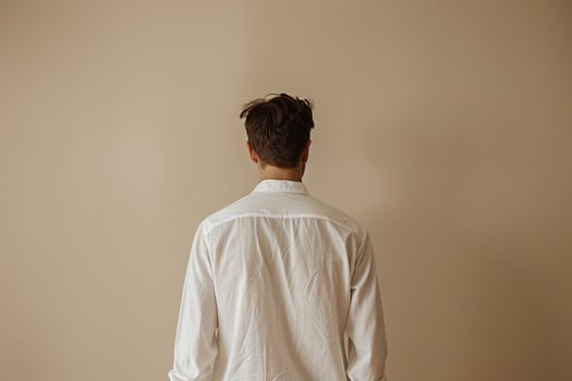Trendy Male Fashion Model in White Shirt with Beige Background for Modern Look photo