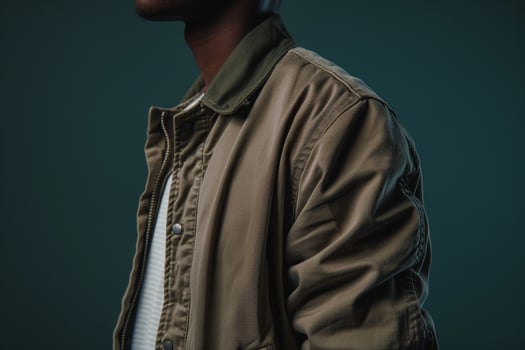 Stylish male fashion model in a trendy jacket male dress apparel witholive green male background illustratingportrait fashion and lifestyle Males eleMalets photo