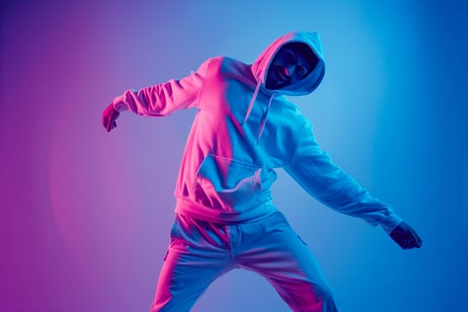 electric Blue Background with Hoodie Clad Male  Lifestyle portrait Showcasing Chic Fashion and Stylish Trends photo