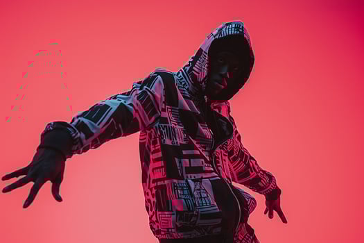 printed Zip Up Hoodie Clad Male with Neon pink Background Fashion portrait Highlighting Trendy and Contemporary Style photo