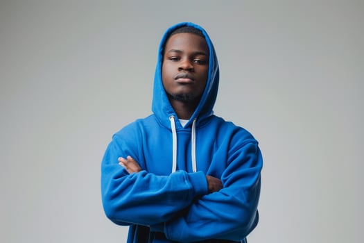 Stylish and Contemporary Look Cobalt Blue Hoodie Clad Male Fashion portrait with Outfit Background photo