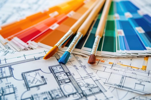 Interior designer choosing colors for apartment renovation project using blueprints photo