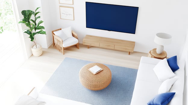 Contemporary living room with natural light, featuring a cozy couch, stylish decor, and a modern television setup. photo