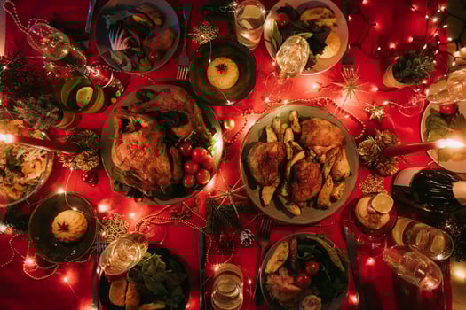Top view no people shot of decorated Christmas table with variety of food and atmosphere of New Year Eve photo