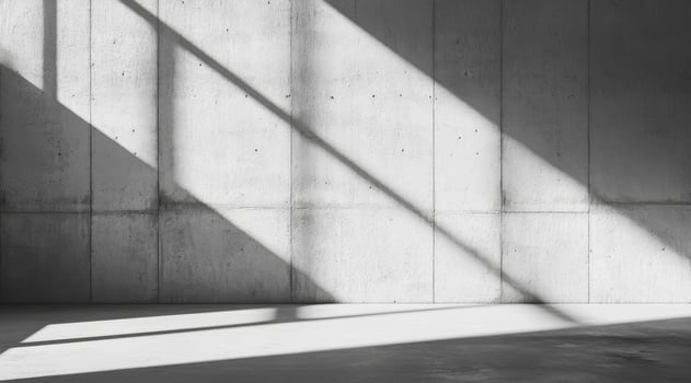 This is a beautifully crafted minimalist concrete backdrop that showcases dynamic interplay between light and shadow, making it the ideal choice for stylish product presentations and exhibits photo