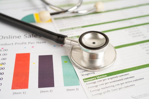 Stethoscope on spreadsheet and graph paper, Finance, Account, Statistics, Investment, Analytic research data economy and Business company concept. photo