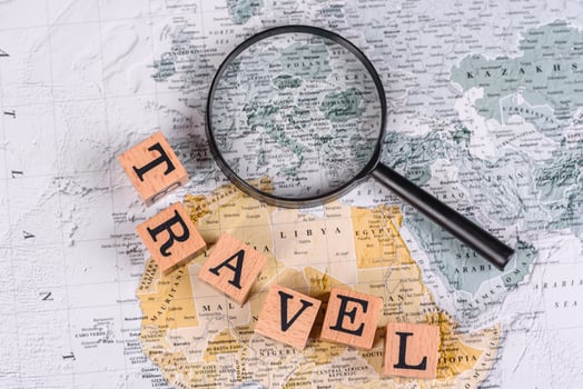 Conceptual background for travel with passport, magnifying glass, world map and money photo