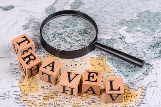 Conceptual background for travel with passport, magnifying glass, world map and money photo