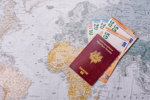 Conceptual background for travel with passport, magnifying glass, world map and money photo