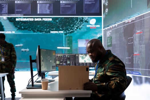 Army crew officer in a control center oversees satellite data and missions details, providing real time surveillance for defense operations. Monitoring cctv radar systems on computer. photo