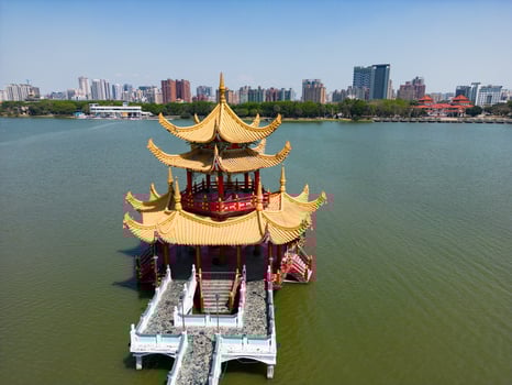 Aerial Perspective of Taiwan Historic Spring and Autumn Pavilion Over Calm Lake photo