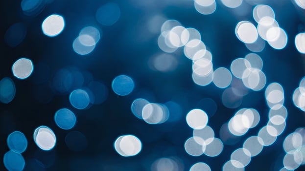 blue lights are shown in a photo of a dark background
