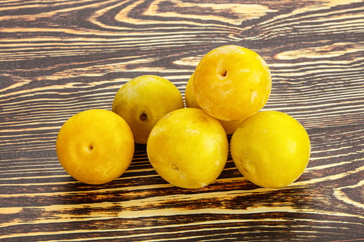 Yellow sweet plum heap fruit photo