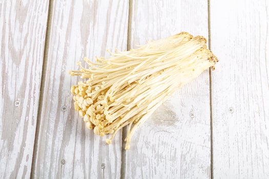 Tasty raw enoki mushroom heap photo