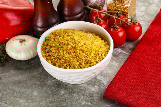 Dry wheat bulgur cereal heap photo