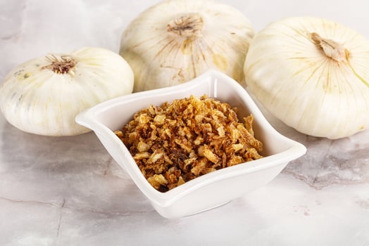 Dried roasted onion flakes for culinary photo
