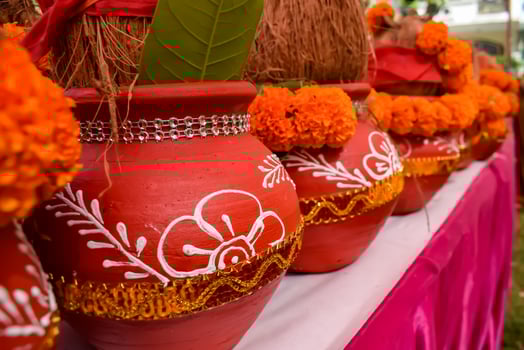 Kalash with coconut and mango leaf with floral decoration earthen pots containing sacred water. Kalash for hindu puja during Jagannath Temple Mangal Kalash Yatra, front view, closeup photo