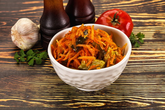 Salad with korean carrot and cucumber photo