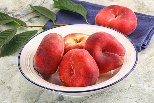 Ripe sweet and juicy Flat peach photo