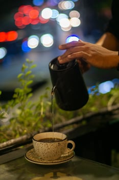 Person Pouring Hot Water to Make Coffee photo