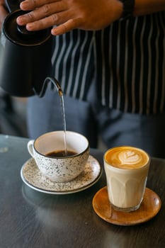 Person Pouring Hot Water to Make Coffee photo