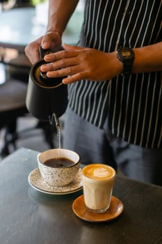 Person Pouring Hot Water to Make Coffee photo