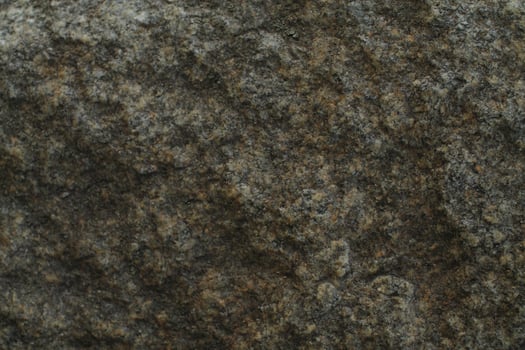 Abstract natural rock stone granite grunge rusty metal texture design background natural color stone material granite design wallpaper. Close-up detail of natural stone photo
