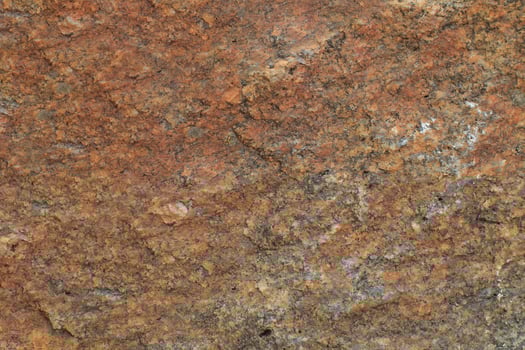Abstract natural rock stone granite grunge rusty metal texture design background natural color stone material granite design wallpaper. Close-up detail of natural stone photo