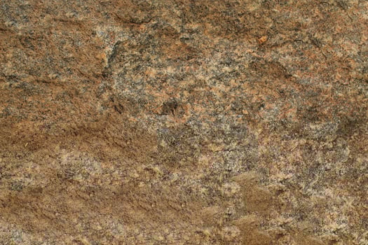 Abstract natural rock stone granite grunge rusty metal texture design background natural color stone material granite design wallpaper. Close-up detail of natural stone photo