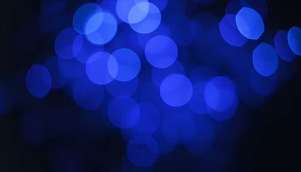 blue bokeh lights on black background photo