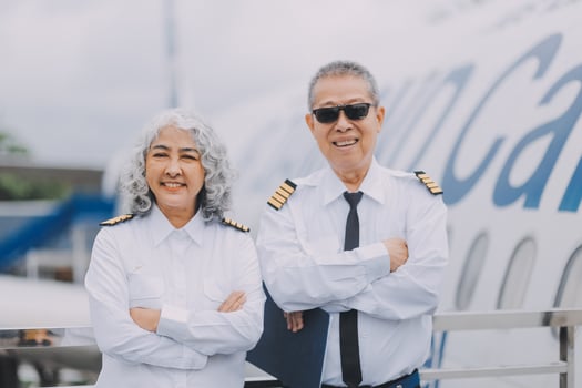 Professional pilot woman in uniform has teamwork meeting for success flight in aviation business. Young female captain instructor sitting in office and working or training commercial airline crew. photo