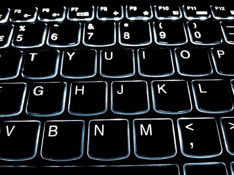 Closup View of Computer Keyboard with backlit keys photo