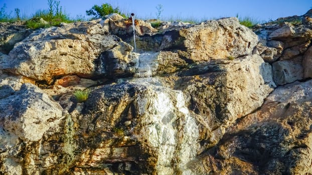 At sea, the water flowing from the hydrogen sulfide from oil wells photo