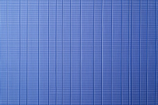 A seersucker texture background features alternating smooth and puckered stripes, creating a crinkled, wavy appearance photo