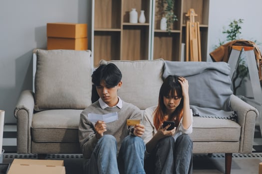 Worried annoyed young husband wife using phone credit card dissatisfied with interrupted wifi internet connection slow bad app work. Angry family couple bank clients unable to pay online check balance photo