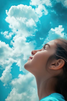 High school girl gazes at the cloudy sky during a sunny day photo