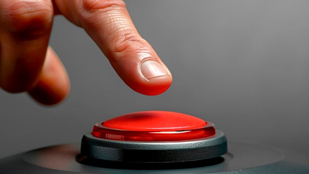 Close-Up of Hand Pressing Red Panic Button. Urgent Action, Emergency Response, Critical Situation. photo