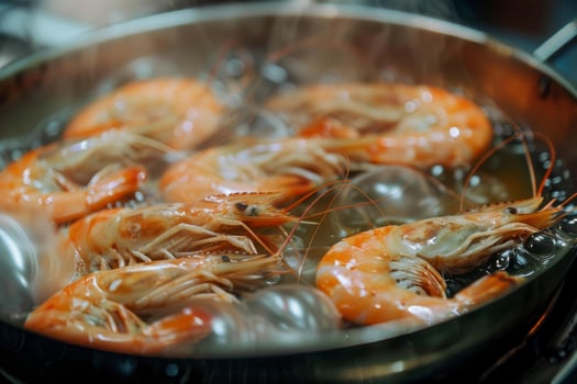 Fresh giant tiger prawns boiling in pan with steam photo